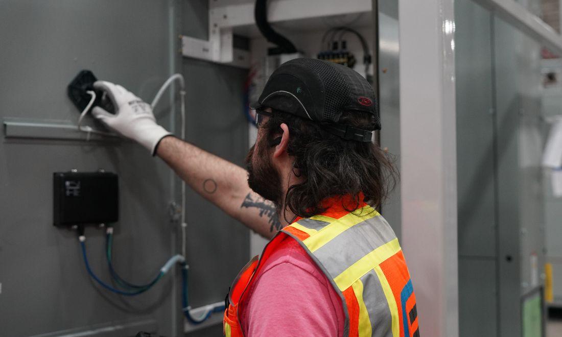 CEI worker doing electrical work