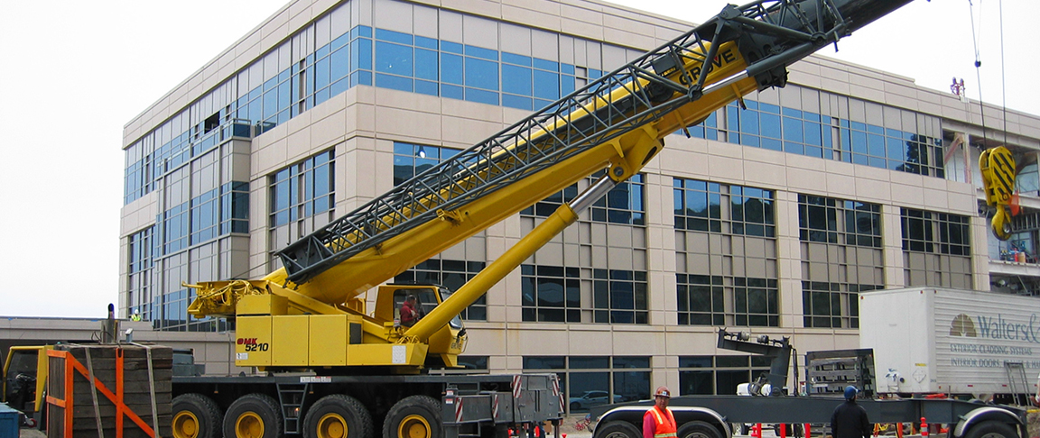 Cranes assist the crew to get the biotech commercial campus project completed on time